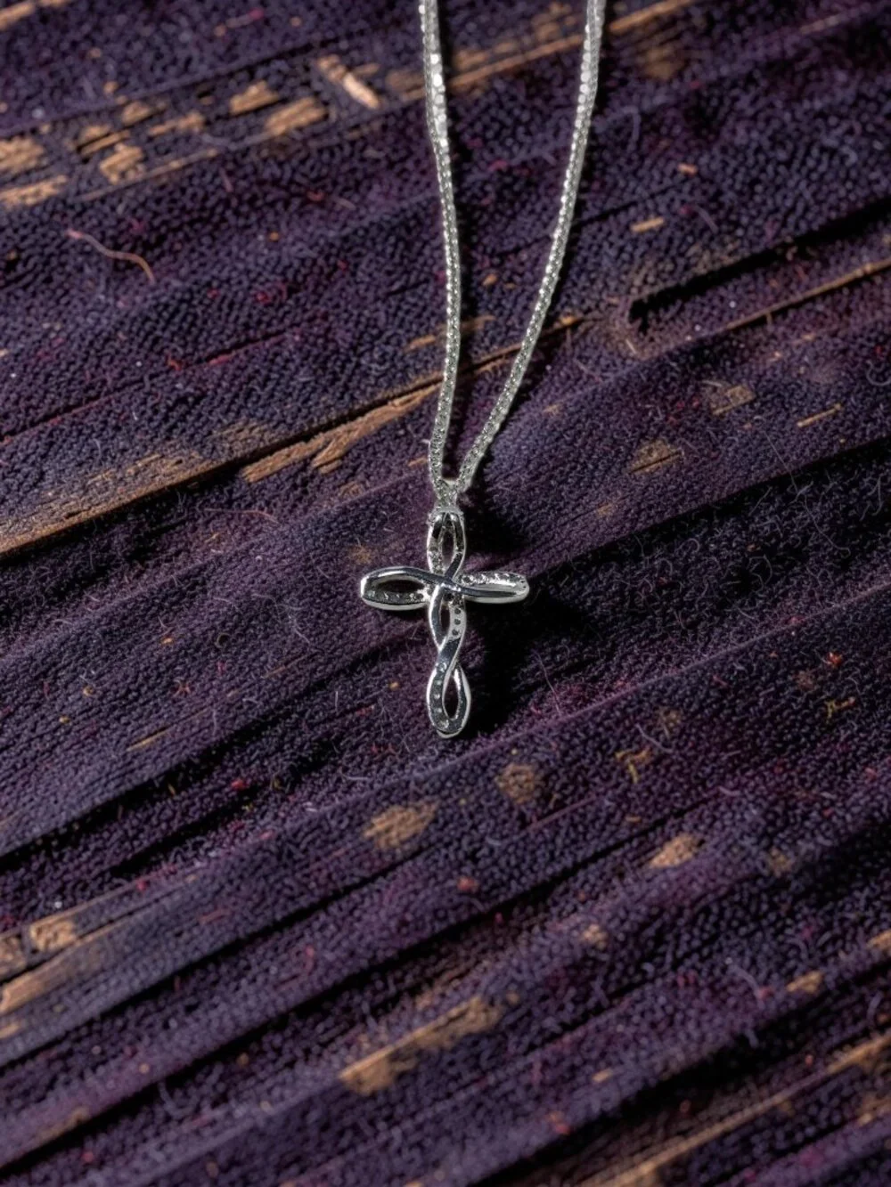 vintage Chrystal lined spiraled curled cross on a .925 sterling necklace